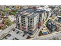 Aerial view of condo building with surrounding street and neighborhood at 435 Virginia Ave # 402, Indianapolis, IN 46203