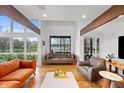 Bright living room with hardwood floors, exposed beams and beautiful lake views at 4561 Coles Dr, Columbus, IN 47201