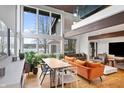 Open living and dining area with lake views, hardwood floors and stylish decor at 4561 Coles Dr, Columbus, IN 47201