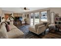 Comfortable living room with a large sectional, TV, modern decor, and plenty of natural light at 500 N Shellbark Rd, Muncie, IN 47304