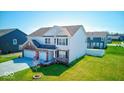 Attractive home with a lush lawn, mature landscaping, and a three-car garage at 5839 Altar Bell Cir, Greenwood, IN 46143