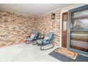 Inviting front porch featuring two comfortable rocking chairs, perfect for relaxing outdoors at 632 Ridgeview Ln, Columbus, IN 47201