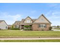 Beautiful single-Gathering home with mature lawn, tasteful landscaping, and brick exterior at 732 Trillium St, Lebanon, IN 46052