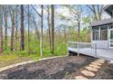The backyard features a tiered deck with access to a screened in porch, and woodland views at 8695 Shoe Overlook Dr, Fishers, IN 46038