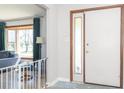 Inviting entryway featuring geometric tile flooring, a front door, and living room view at 918 N 700 W, Greenfield, IN 46140