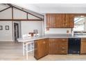 Bright eat-in kitchen with wood cabinets, a black dishwasher, and breakfast bar at 918 N 700 W, Greenfield, IN 46140