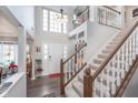Grand foyer with high ceilings, beautiful staircase, and abundant natural light at 10518 Greenway Dr, Fishers, IN 46037