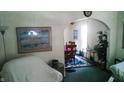 Comfortable living area featuring an open archway to the dining area with vintage furnishings at 1303 S Shipley St, Muncie, IN 47302