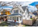 Attractive two-story home boasts a classic design and manicured landscaping at 1417 Sturm Ave, Indianapolis, IN 46201