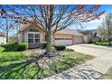 Charming home with attached garage, manicured landscaping, and mature tree at 2755 Rylee Ct, Greenwood, IN 46143