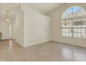 Bright living room featuring tile floors, large windows, and a chandelier at 2755 Rylee Ct, Greenwood, IN 46143