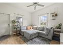 Inviting living room featuring a large sectional sofa, plants, and natural light at 282 N Vine St, Plainfield, IN 46168