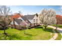 Stunning aerial view of a well-maintained home with lush greenery and mature trees at 3165 Hazel Foster W Ct, Carmel, IN 46033