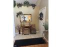 Inviting entryway with a mirror, decorative accents, and stylish flooring at 5338 Traditions Dr, Indianapolis, IN 46235