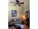 Comfortable living room with a ceiling fan, plush seating, and natural light at 5338 Traditions Dr, Indianapolis, IN 46235