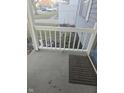 Cozy front porch with a white railing, perfect for enjoying the outdoors at 5338 Traditions Dr, Indianapolis, IN 46235