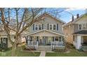 Traditional two-story home with a welcoming porch and a well-maintained lawn at 601 Wallace Ave, Indianapolis, IN 46201
