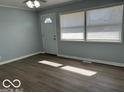 A bright living room with two large windows, filling the space with natural light and a welcoming atmosphere at 6642 E 47Th St, Indianapolis, IN 46226