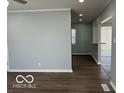 A view of the living room, offering sleek hardwood floors and a seamless transition to other spaces in the home at 6642 E 47Th St, Indianapolis, IN 46226