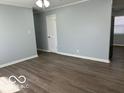 A well-lit living room with hardwood floors and neutral walls, ready for comfortable living and entertaining at 6642 E 47Th St, Indianapolis, IN 46226