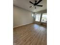 Bright bedroom featuring wood-look floors, a ceiling fan, recessed lighting, and large windows offering a pleasant view at 798 James William Ln, Westfield, IN 46074