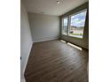 Bright home office with wood-look floors and large windows offering an abundance of natural light at 798 James William Ln, Westfield, IN 46074