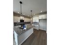 Modern kitchen with granite counters, stainless steel appliances, and white cabinets at 799 Rose Garden Way, Westfield, IN 46074
