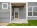View of covered porch with gray horizontal siding and white trim at 799 Rose Garden Way, Westfield, IN 46074