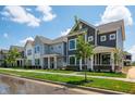 A quiet street showcasing well-manicured lawns and inviting two-story homes in a desirable community at 799 Rose Garden Way, Westfield, IN 46074