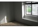 Sunlit bedroom featuring a window with a view and neutral carpet at 8158 Shorewalk Dr # F, Indianapolis, IN 46236