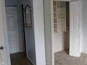 Bedroom interior with open closet showing shelving and hanging space at 8158 Shorewalk Dr # F, Indianapolis, IN 46236
