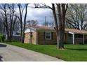 Brick ranch-style home featuring a well-maintained lawn and mature trees at 838 Highland Dr, Whiteland, IN 46184
