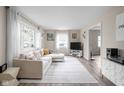 Bright living room featuring a comfortable sectional sofa and ample natural light at 89 E Walnut St, Fountaintown, IN 46130