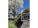 Attractive community building with a meticulously maintained lawn and a mature Bradford Pear tree at 963 Wickham Ct # 103, Carmel, IN 46032