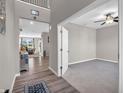 Open foyer showcasing wood floors and natural light flowing into the living spaces at 1075 Barberry Dr, Greenwood, IN 46143