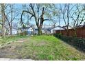 Expansive backyard featuring a grassy area and bordering fence at 1145 N Belleview Pl, Indianapolis, IN 46222
