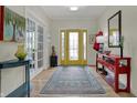 Inviting foyer with a colorful rug and lots of natural light at 14019 Colville Cir, Carmel, IN 46033