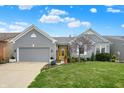Beautiful home with a well-manicured lawn and appealing landscaping at 14019 Colville Cir, Carmel, IN 46033