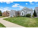 Attractive home with manicured lawn and well-maintained landscaping at 14019 Colville Cir, Carmel, IN 46033