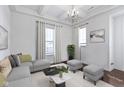 Bright living room features recessed lighting, a modern sofa and contemporary decor at 1444 Waterleaf Dr, Westfield, IN 46074