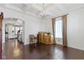 Spacious living room with coffered ceilings, hardwood floors, and natural light at 1444 Waterleaf Dr, Westfield, IN 46074