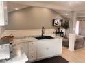 Bright kitchen showcasing marble countertops, black sink fixtures, and stylish white cabinets at 2517 Horton Dr, Anderson, IN 46011