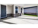 Cozy front porch showcasing seating next to the front door at 2779 Ruffian Dr, Westfield, IN 46074