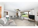 Comfortable living room with neutral colors, a large window, and cozy seating arrangements at 3607 Windsor Way, Anderson, IN 46011