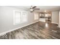 Open-concept layout with hardwood floors, seamlessly connecting the living room and kitchen at 4742 Primrose Ave, Indianapolis, IN 46205