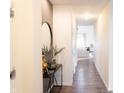 Bright hallway with modern decor and wood-look flooring leading to the living area at 5301 Tanglewood Ln, Whitestown, IN 46075