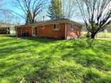 Expansive backyard featuring a well-maintained lawn and mature trees, ideal for outdoor activities at 7132 N Stafford Ln, Martinsville, IN 46151