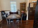 Eat-in kitchen features a dark table with four chairs set up for a meal at 1018 E 106Th St, Indianapolis, IN 46280