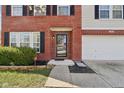 Well-maintained brick home with black shutters, manicured landscaping, and a covered front entryway at 10303 Memorial Knoll Dr, Indianapolis, IN 46234