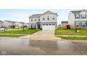 Two-story home with gray siding, a two-car garage, and a freshly cut lawn at 13820 N Cardonia Dr, Camby, IN 46113